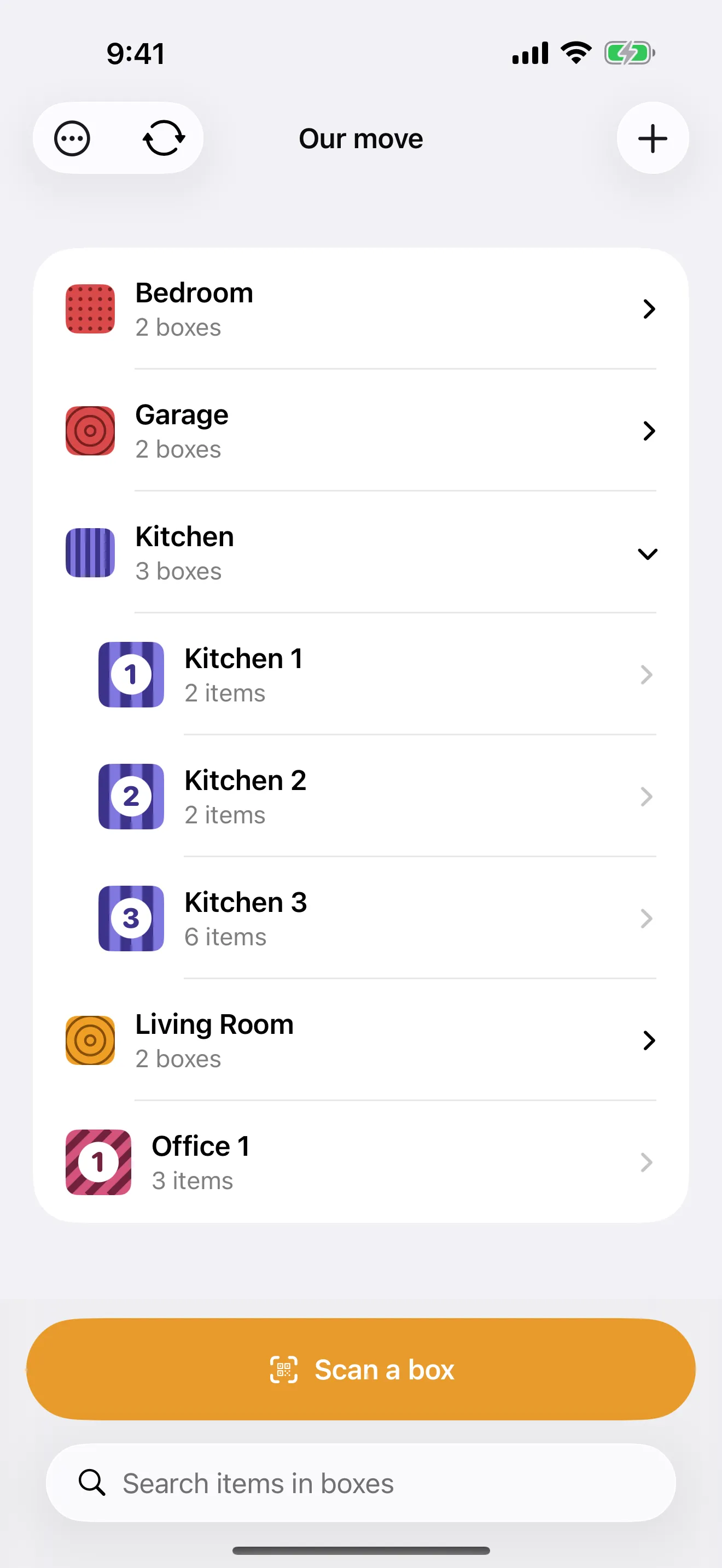 The Packmap home screen listing moving boxes with color-coded badges