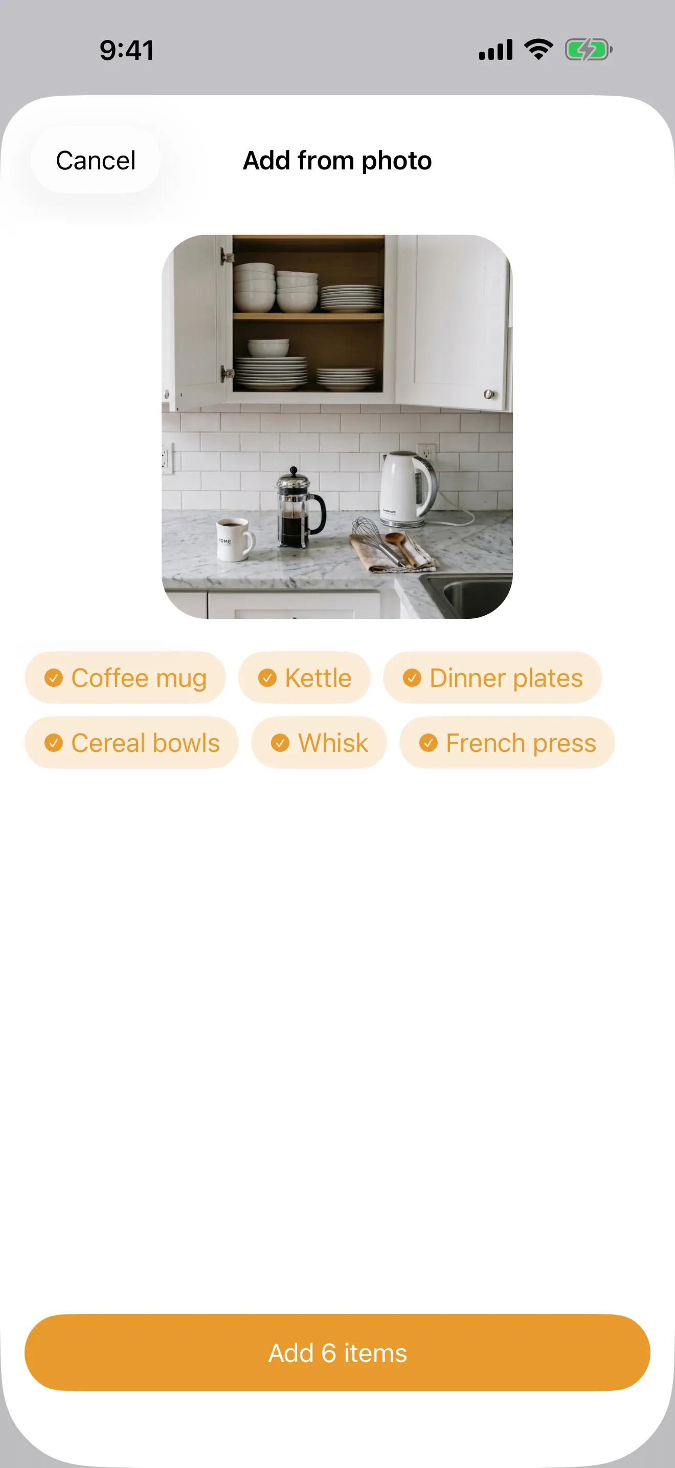 Packmap suggesting items it recognized in a photo, as tappable tags