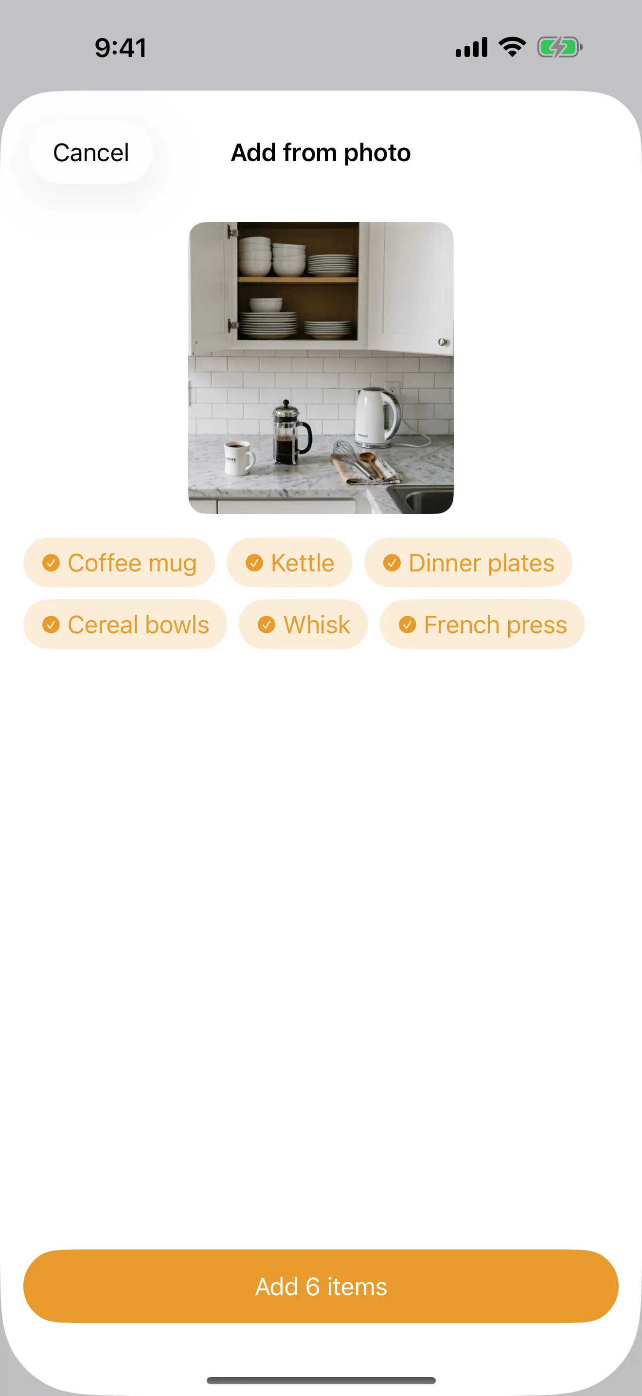 Packmap suggesting items it recognized in a photo, as tappable tags